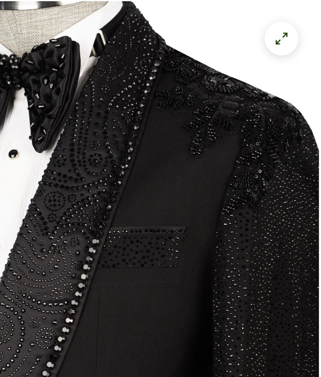 Black Tuxedo with intricate beadwork on a mannequin close up.