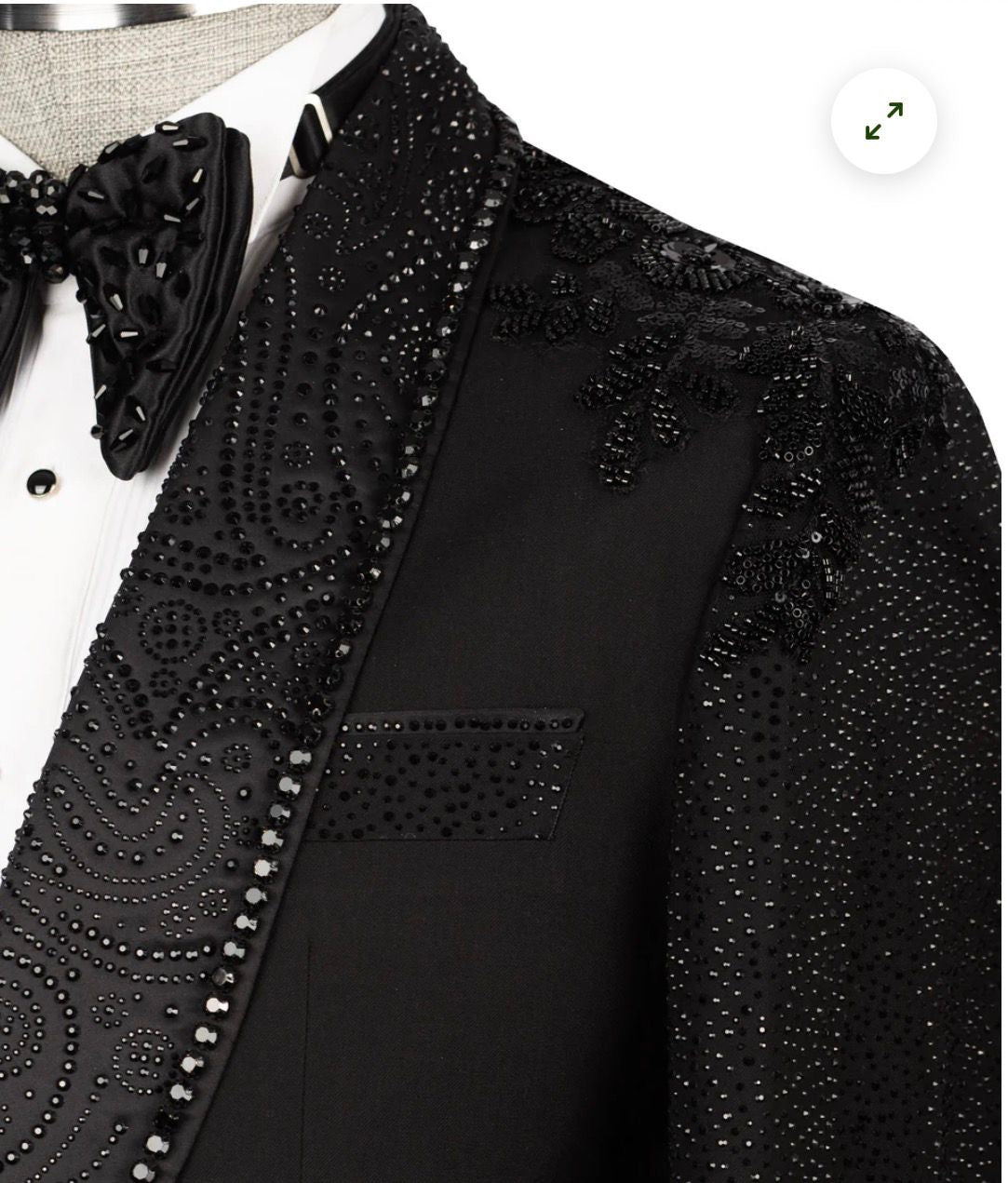 Black Tuxedo with intricate beadwork on a mannequin close up.