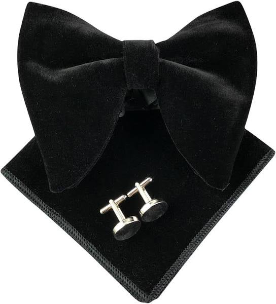 Black bow tie and cufflinks set on a black tray