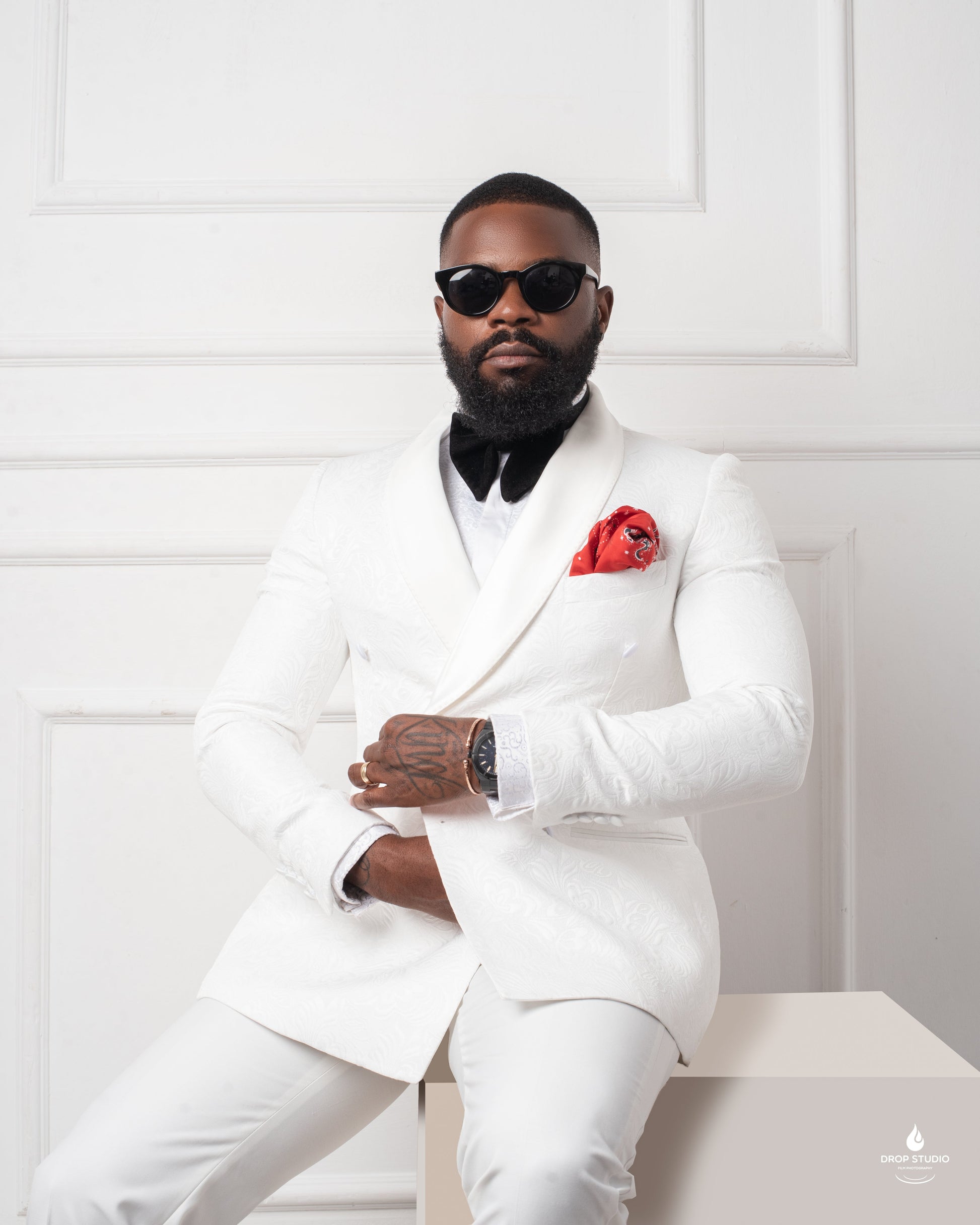 man in Ivory monarch paisley tuxedo