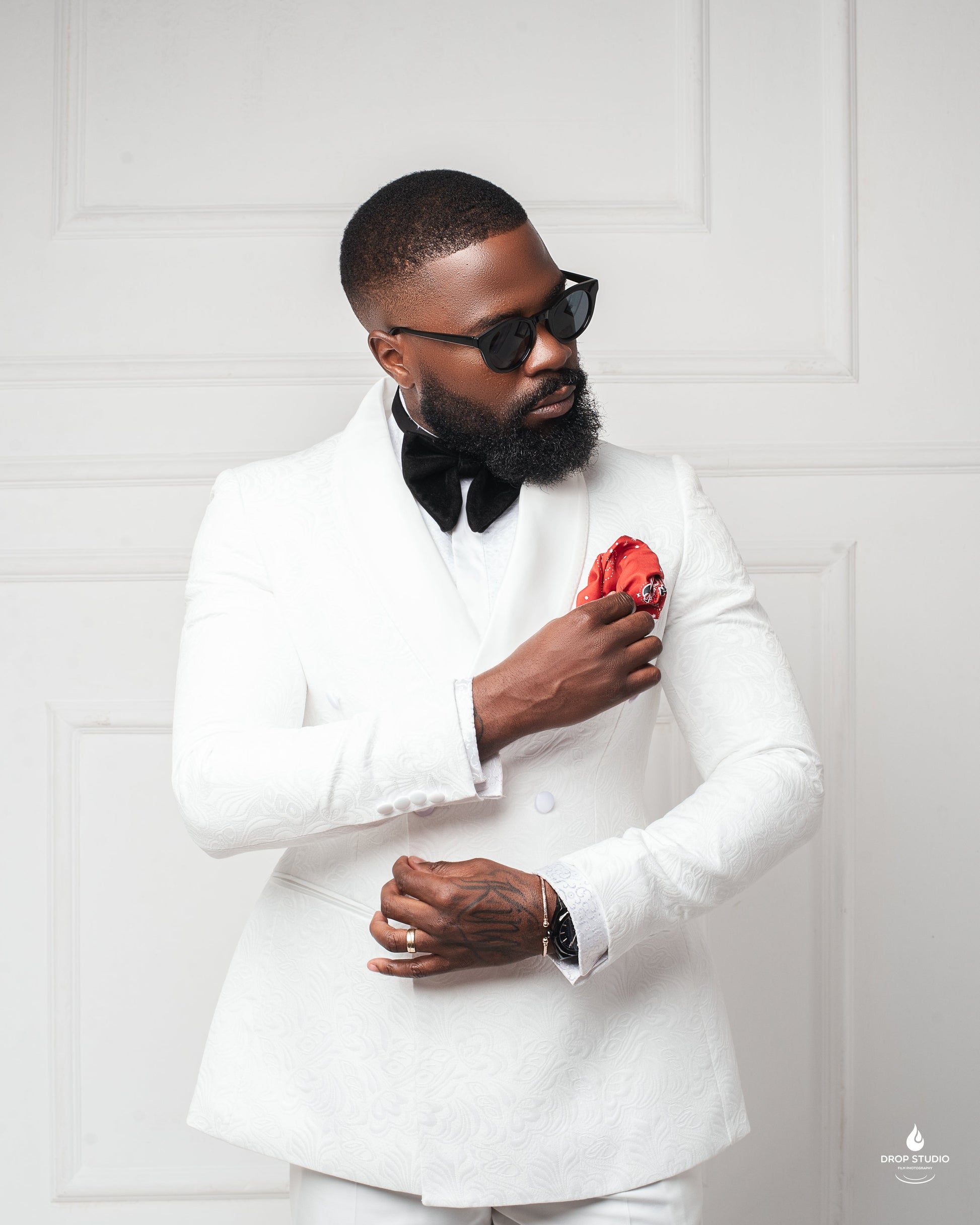 man in Ivory monarch paisley tuxedo