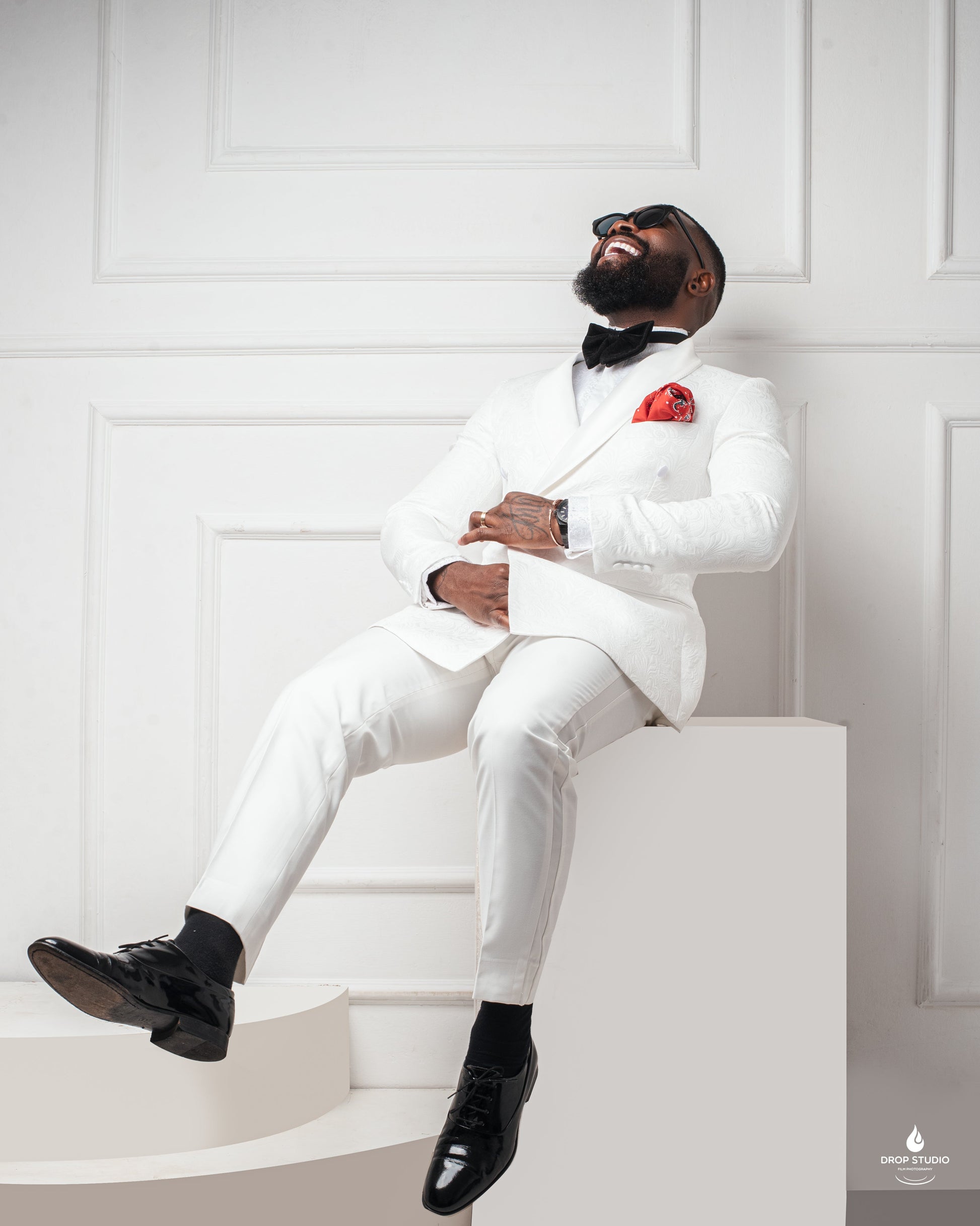 man in Ivory monarch paisley tuxedo