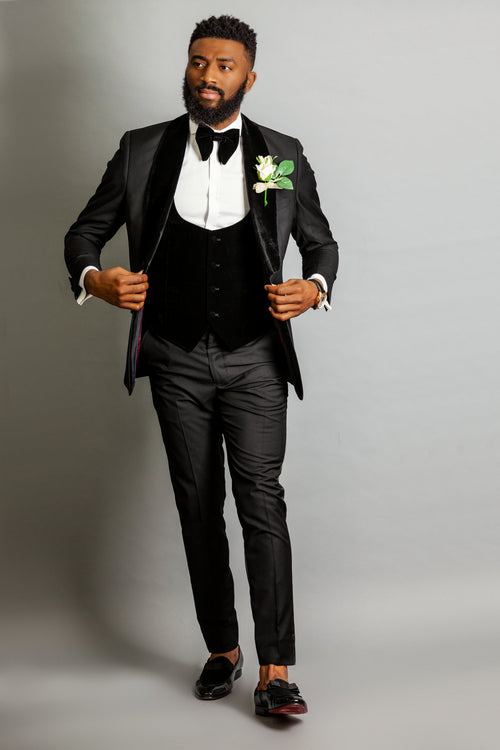 man in groomsmen black tuxedo package